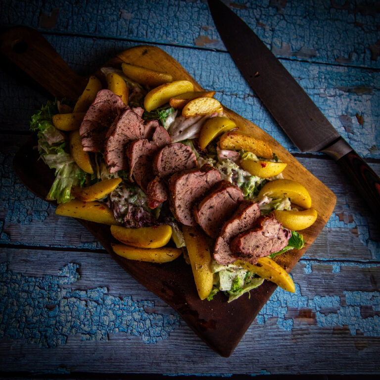 Iberico Tenderloin van de BBQ met rosé garing en gegrilde groenten